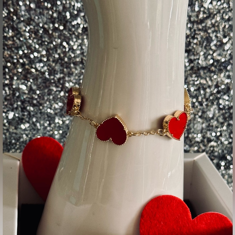 Designer style both sides heart enamel, and gold plated bracelet.